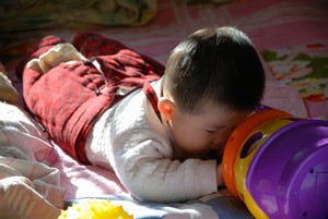 infant playing on floor